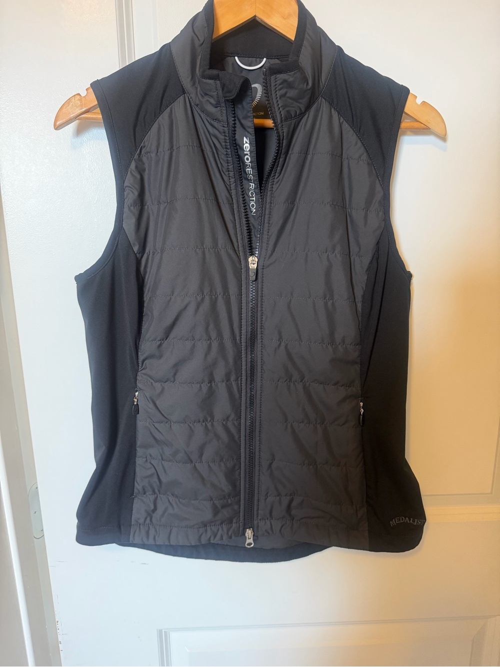 Zero Restriction w Medalist golf club logo Women's Black Performance Vest.